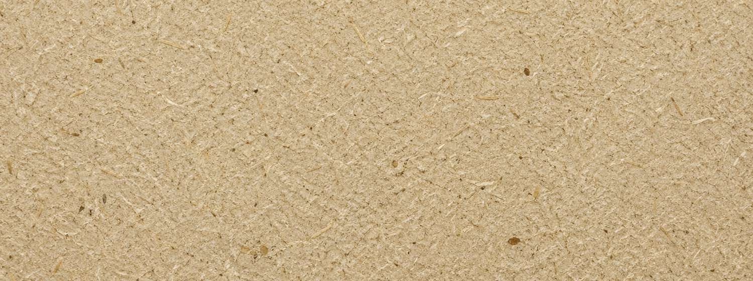 Close view of unbleached bagasse pulp board surface